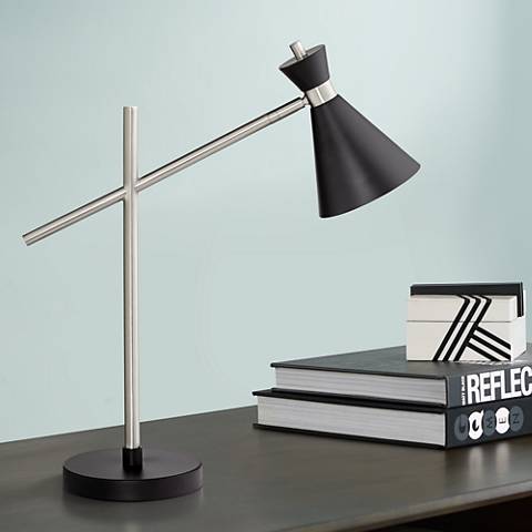 A desk lamp with a black shade. 